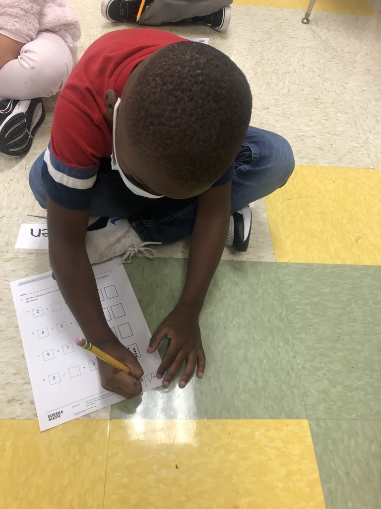 Aiden learning how to count on in Math.